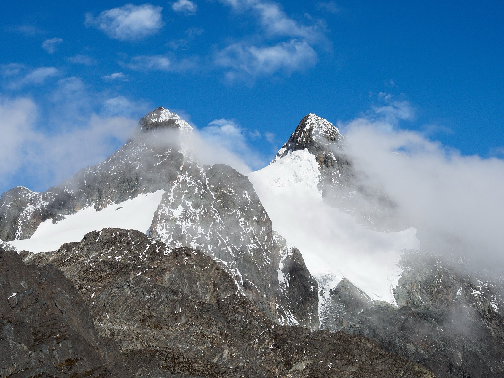 Snow-covered peaks of the Rwenzori Mountains among cloud